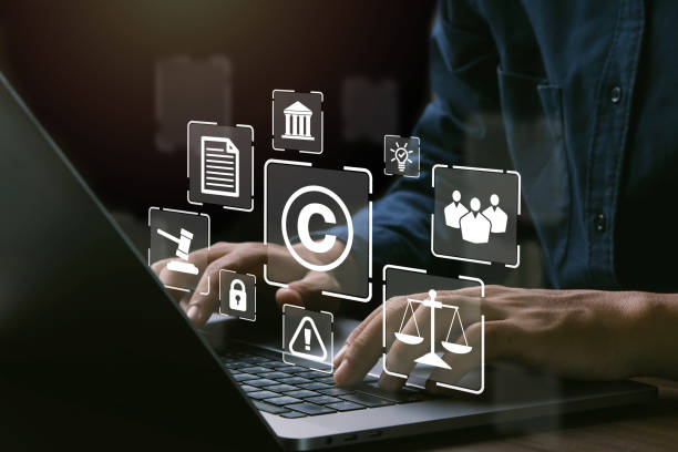istock Copyright or patent concept.Man hand using laptop with Copyright Symbol to represent the protection of intellectual property. 1613809278