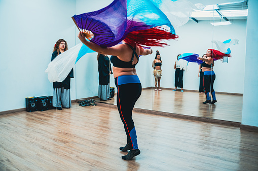 Belly dancer rehearsing choreography at dance studio
