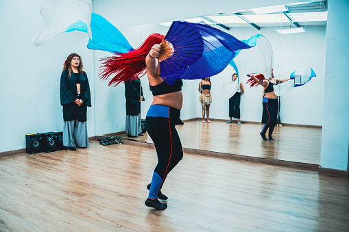 Belly dancer rehearsing choreography at dance studio