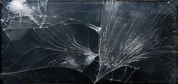 Broken glass texture on black background stock photo