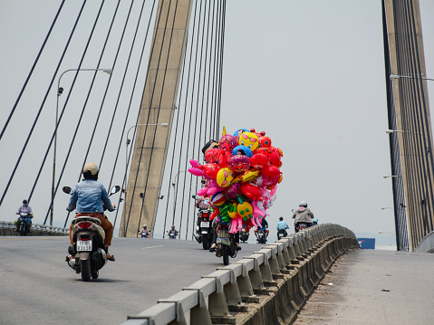 Hai Phong, Vietnam - May 21, 2016. Traffic on the Binh Bridge in Hai Phong, Vietnam. Haiphong is Vietnam third largest city and a major port near Hanoi.