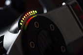 Close up view on a racing steering wheel with RPM LED  indicators