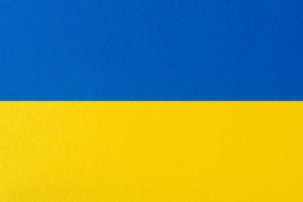 istock Ukrainian flag painted on cardboard paper (texture, background) 1613873405