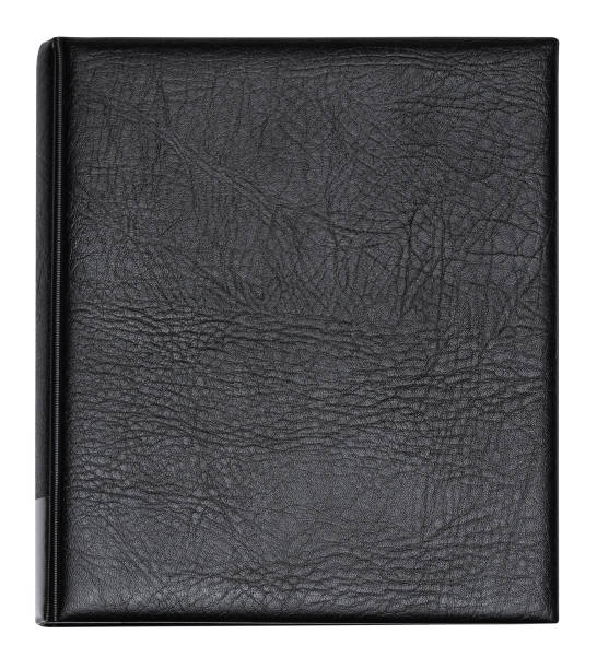istock Book with black leather cover, isolated on a white background 1613873420