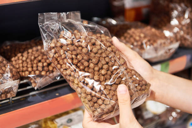 istock Chocolate balls for breakfast in package in store 1613887318