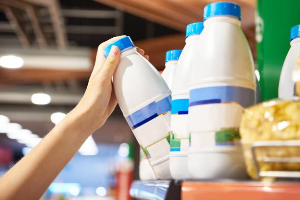 istock Woman shopping milk 1613887331