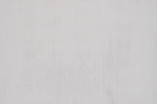 light gray painted wooden background with subtle wood grain texture