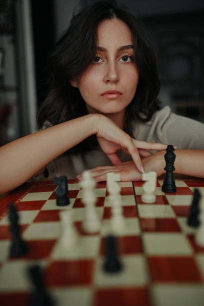 istock Front View Of Gorgeous Female Dominating The Chess Board 1613911446