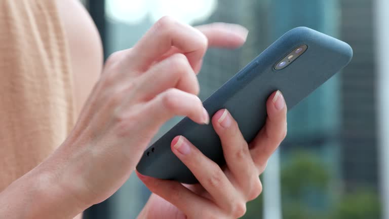 Close up of woman using smart phone