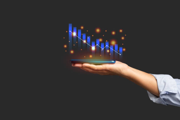 istock Digital increasing bar business graph growth on the palm with a black background 1613942552