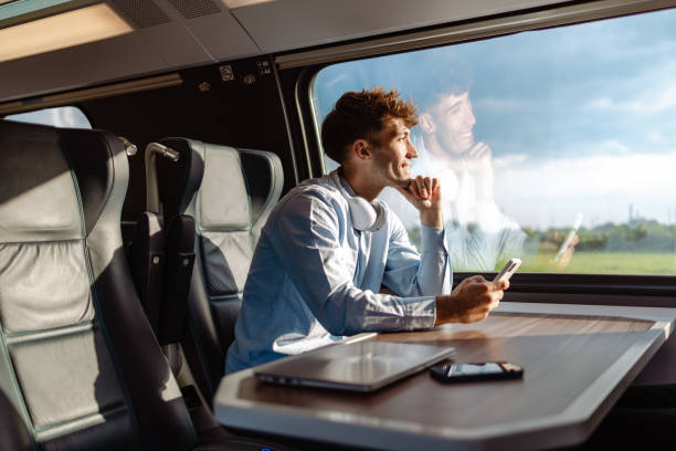 istock Business-Casual Man Travels by Train 1613944655