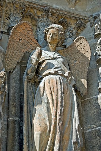 Reims, France, Religious Monuments, Notre-Dame Cathedral, Detail Architecture, Smiling Angel Statue at Front Doorway