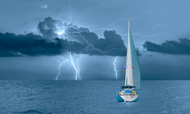 Sailing yacht in a stormy weather with thunder and lightning