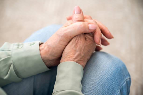 istock Mature retired woman with folded hands on knees 1614010690