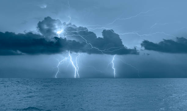 istock Beautiful landscape with lightning over the calm sea 1614011750