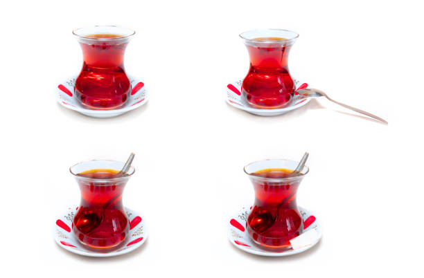 quatre verres de thé turc isolés sur fond blanc - tea cup cup shape red photos et images de collection
