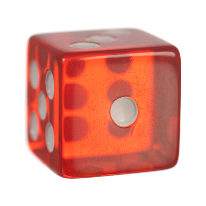 A single red dice on white