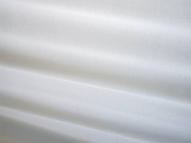 nahaufnahme eines weißen leinwands mit subtilen, hellen linearen mustern - chevron textile striped close up stock-fotos und bilder