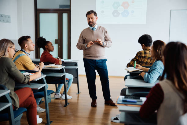 istock Mature teacher giving a lecture to university students in the classroom. 1614144599