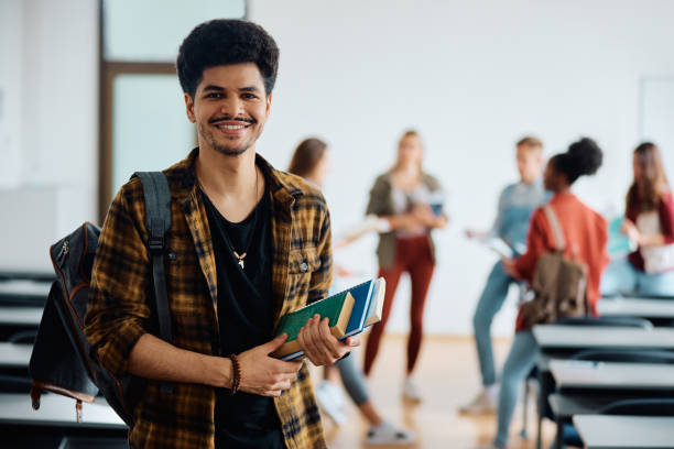 istock Happy Middle Eastern student in university classroom looking at camera. 1614145104