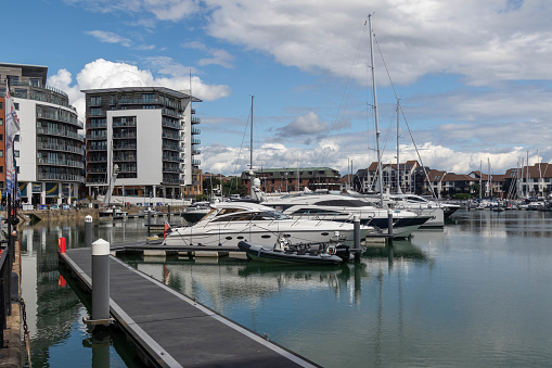 1 June 2019: Lowestoft, Suffolk, UK - Royal Norfolk and Suffolk Yacht Club, and boats in the harbour.
