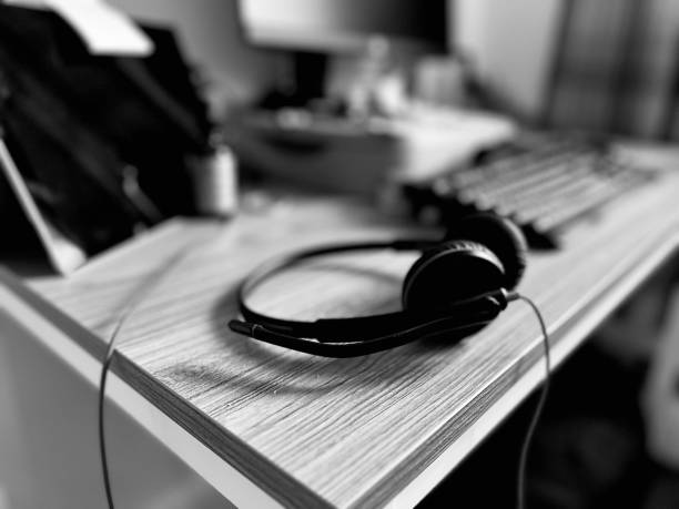 Headphones and keyboard on an office desk