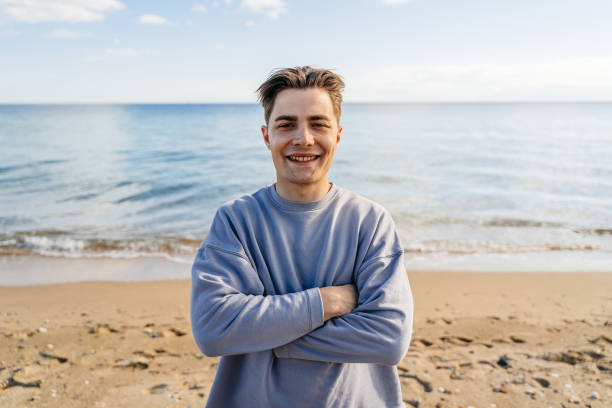 istock Young Man On The Beach In Greece 1614185464