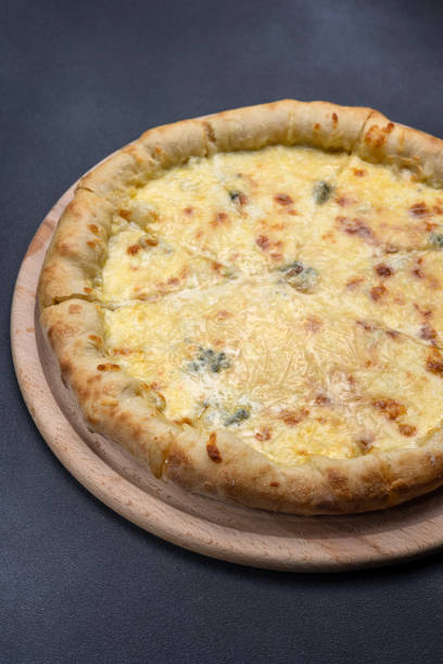 istock Italian cuisine. Delicious pizza on a dark background 1614192519