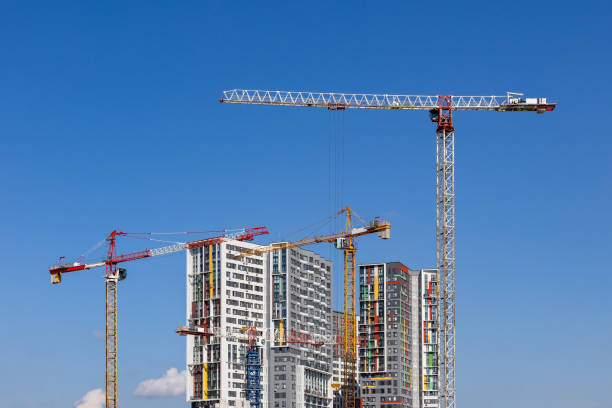 istock Tower cranes near the residential building 1614201640