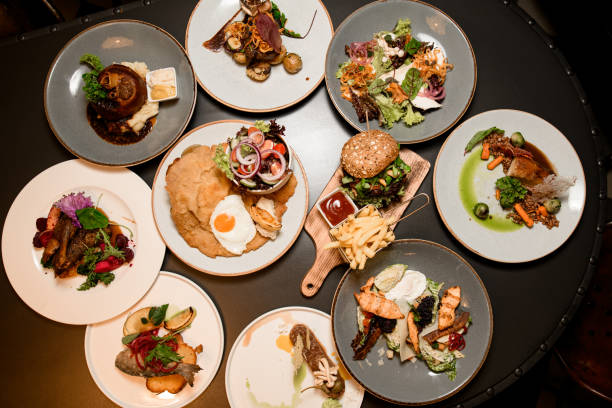 istock top view of plates with different dishes on table 1614206507