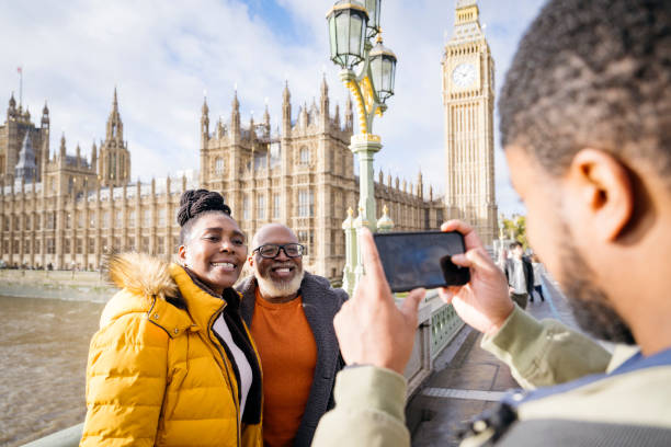 istock Tourists pose for picture on Westminster Bridge, London 1614214730