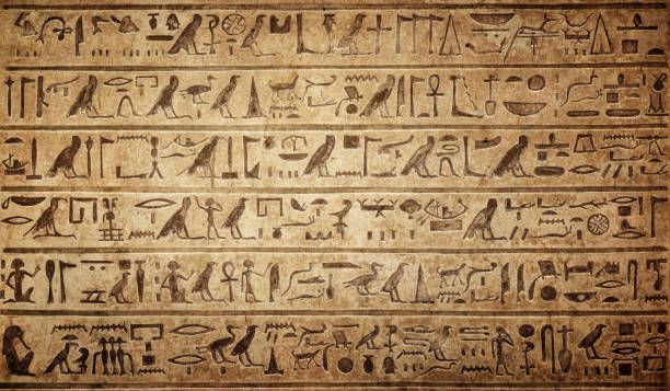Old Egyptian hieroglyphs on an ancient background. Wide historical background. Ancient Egyptian hieroglyphs as a symbol of the history of the Earth.