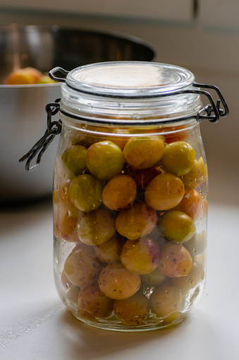 Sterilized mirabelle plums, homemade fruits in syrup for the winter, preserves nutrients