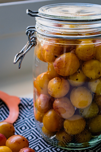 Sterilized mirabelle plums, homemade fruits in syrup for the winter, preserves nutrients