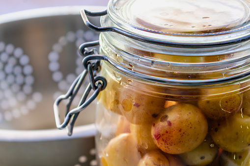 Sterilized mirabelle plums, homemade fruits in syrup for the winter, preserves nutrients