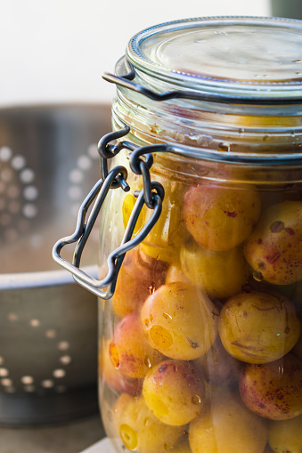 Sterilized mirabelle plums, homemade fruits in syrup for the winter, preserves nutrients