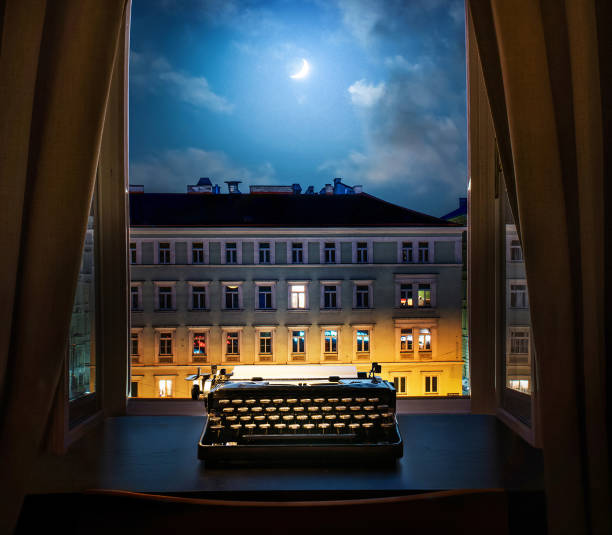 istock Workplace of a writer, journalist, creator. Old typewriter on the table against the background of ancient night city buildings. Retro style. The concept on scientific, historical, literature, education and philosophical topics. 1614248917