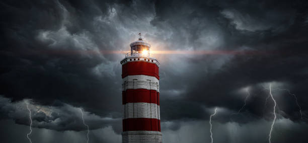 istock View on typhoon, hurricane, tornado, lighthouse and rain sky. Panoramic view of the stormy sky, lighthouse and dark clouds. Concept on the theme of weather, natural disasters,  tornadoes, typhoons. 1614257761