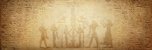 Photo of Gods of ancient egypt and old Egyptian hieroglyphs on ancient background. Wide historical background. Ancient Egyptian hieroglyphs as a symbol of the history of the Earth.