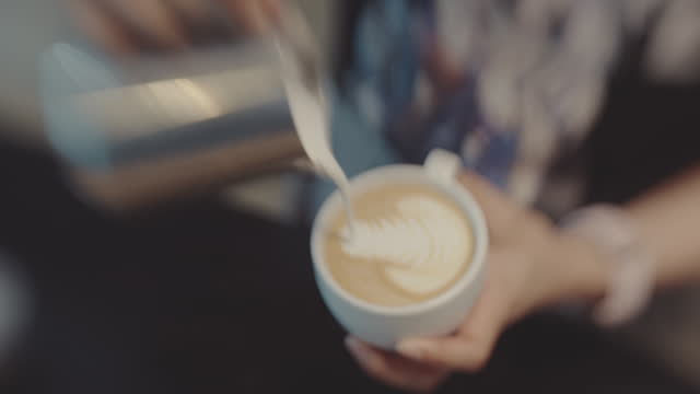 Barista making coffee at coffee shop