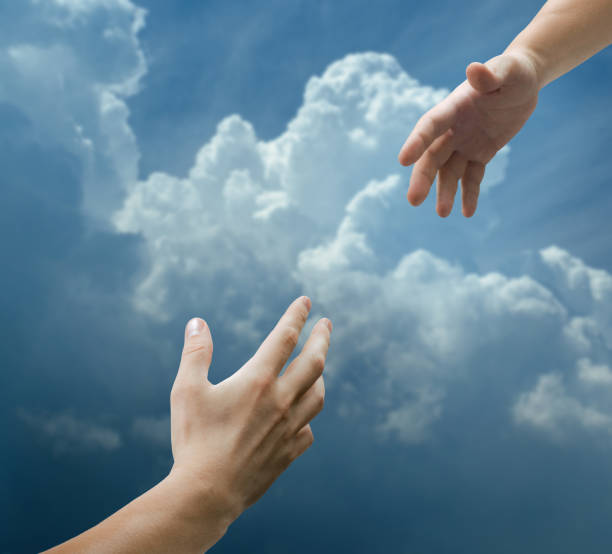 istock Helping hand with the sky background. Concept on the theme of help, support, religion, partnership. 1614270269