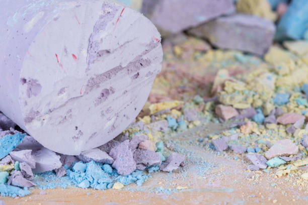 Crumbs and chunk of pastel chalk close-up view