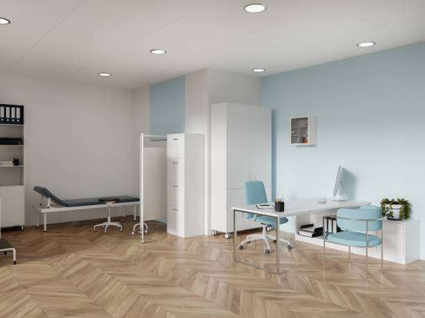 Cozy hospital interior medical bed and doctor's workplace with computer
