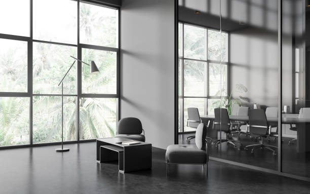 istock Grey business room interior with chill area, meeting board and panoramic window 1614339895