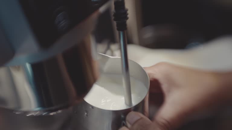 Barista making coffee at coffee shop