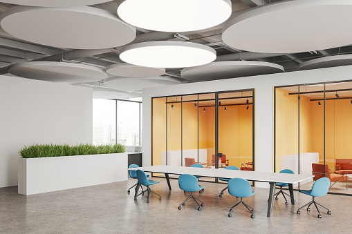 White business room interior with meeting table and chairs, closed colored chill space with armchairs behind glass doors. Panoramic window on skyscrapers. 3D rendering