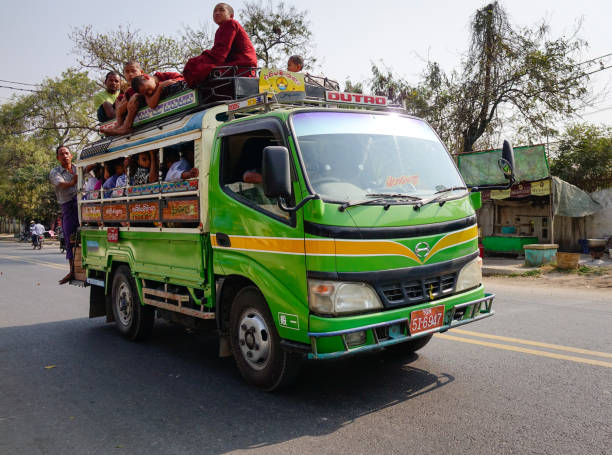 Mandalay, Myanmar - Feb 21, 2016. A local bus running on street in Mandalay, Myanmar. Mandalay is the second-largest city and the last royal capital of Myanmar.