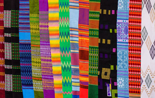 Colorful textile for sale at street market in Mandalay, Myanmar.