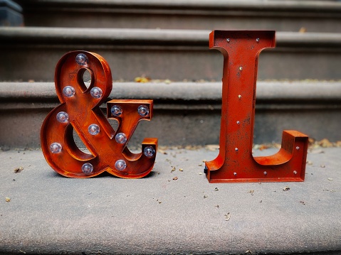 Metal Ampersand and Letter L on a Stoop