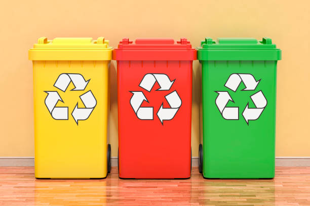 istock Set of colored recycling trash cans in room. 3D rendering 1614384799